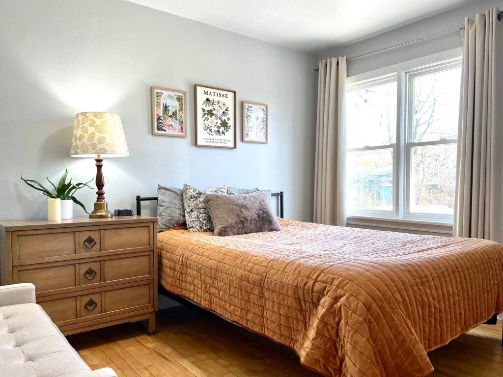 Bedroom #1 with queen bed; nightstand a clock w/ USB and outlets to make charging devices super convenient