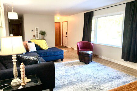 Living Room with 55" Roku Smart TV. Enjoy the comfortable, unique, and retro sofa options. Need extra sleeping space? Comfortable day bed with trundle!