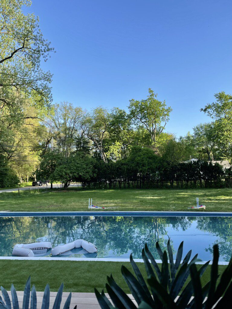 Family Fun at Riverside Pool Paradise! Splash in the pool, relax in the hot tub, or enjoy yard games. Spacious deck with seating! Toddler cabana, & custom art.