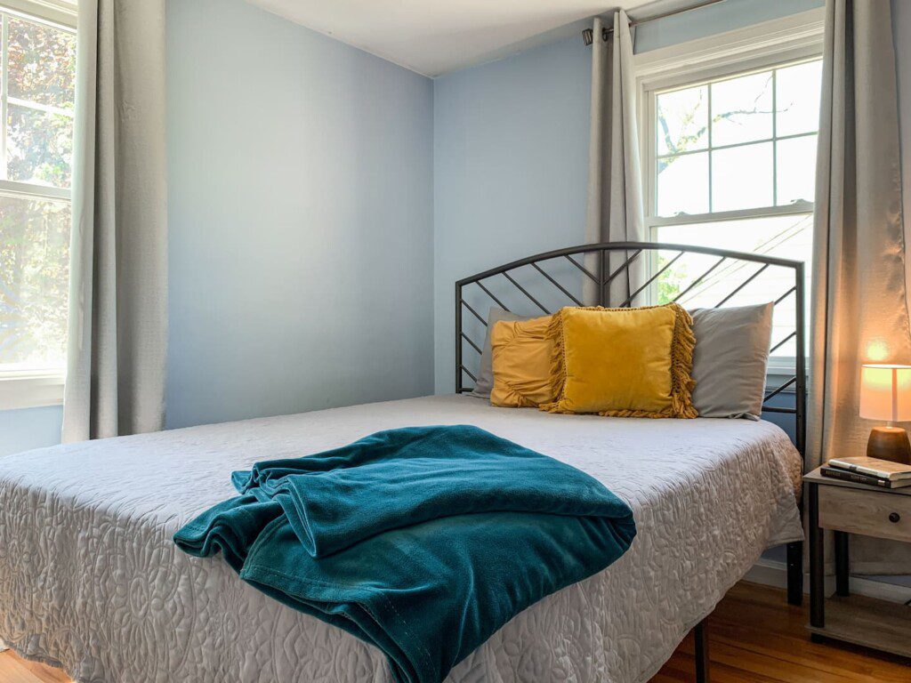 Bedroom #3 with highly rated Lucid queen mattress; 32 Inch Roku TV with YouTubeTV access; nightstand a clock w/ USB and outlets to make charging devices super convenient