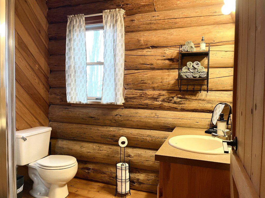 Bathroom #2: upstairs bathroom with shower cabin furnished with towels, wash clothes, shampoo, and soap
