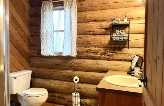 Bathroom #2: upstairs bathroom with shower cabin furnished with towels, wash clothes, shampoo, and soap