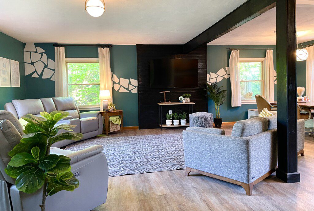 Open Concept for Gatherings! The open-concept living room at Riverside Paradise is perfect for connecting. Kids can play, families can dine, and everyone can enjoy movies on the 65" Fire TV. Custom wall art adds a unique touch to this spacious haven