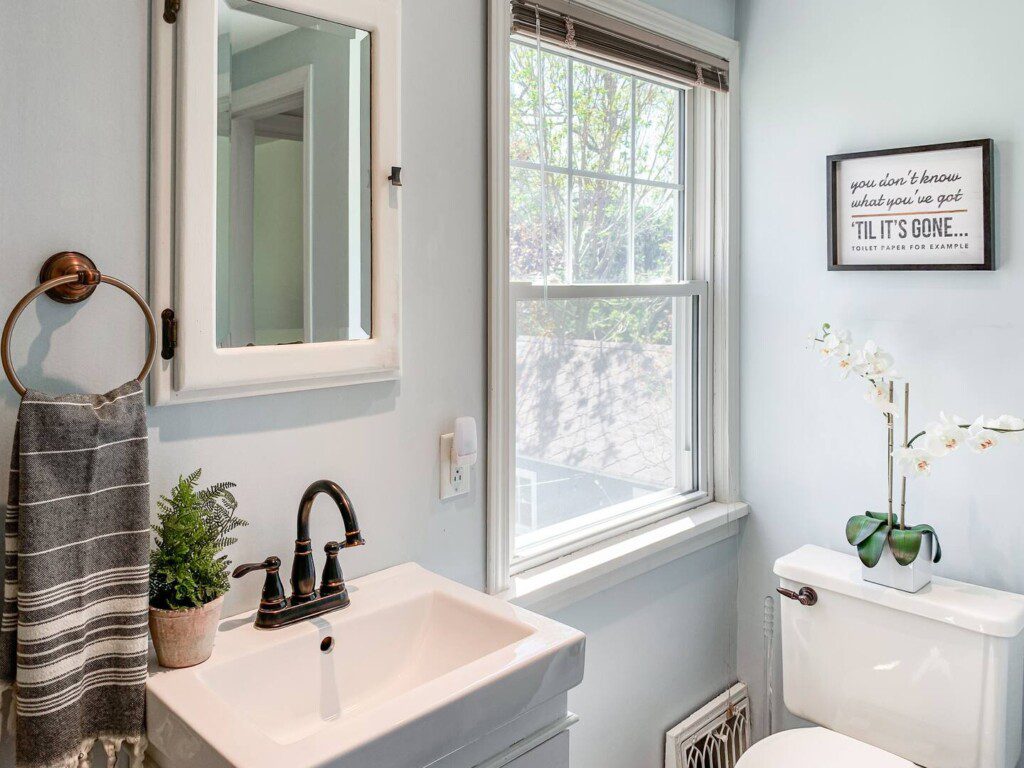 Upstairs bathroom with shower and tub combination.