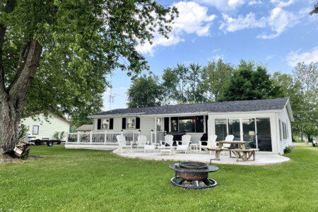 The Waldron Lake Retreat: string lights for great evening relaxation, fire pit, seating, picnic table, sunsets, cookouts, gas grill! We have everything you need for a much needed getaway! 