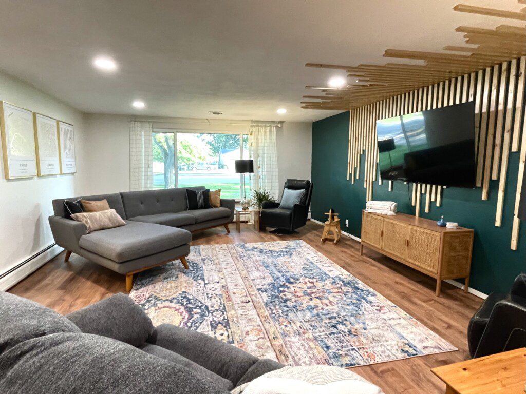 The Unmatched Living Room - Custom Wall Art!! 65" Roku TV with YouTube TV access provided. Enjoy the comfortable and unique sofa options