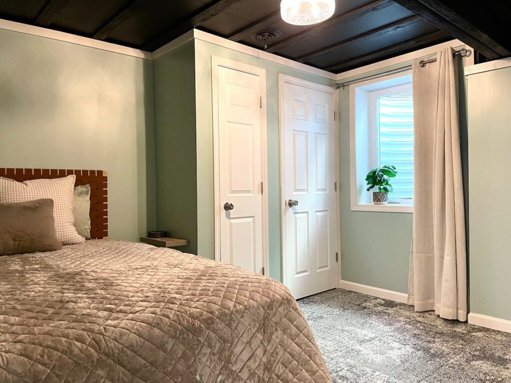 Basement Bedroom with two queen beds; nightstand a clocks w/ USB and outlets to make charging devices super convenient