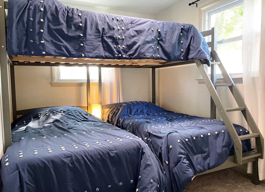 The Waldron Lake Retreat Bedroom #4: 
✔ Double bed with Pillows, Linens, and Sheets on top
✔ Two twin beds with Pillows, Linens, and Sheets on bottom
✔ Touch Reading Lamps with USB plug-ins