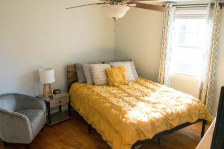 Bedroom #1 with highly rated Lucid queen mattress; 32 Inch Roku TV with YouTubeTV access; nightstand a clock w/ USB and outlets to make charging devices super convenient