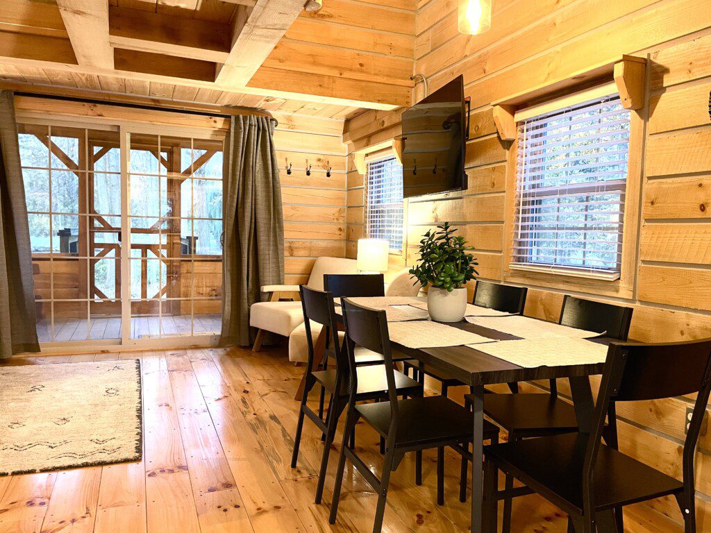 🍽️ Gather and share meals or laughter at this cozy dining table, perfect for family dinners and game nights in your log cabin retreat!
