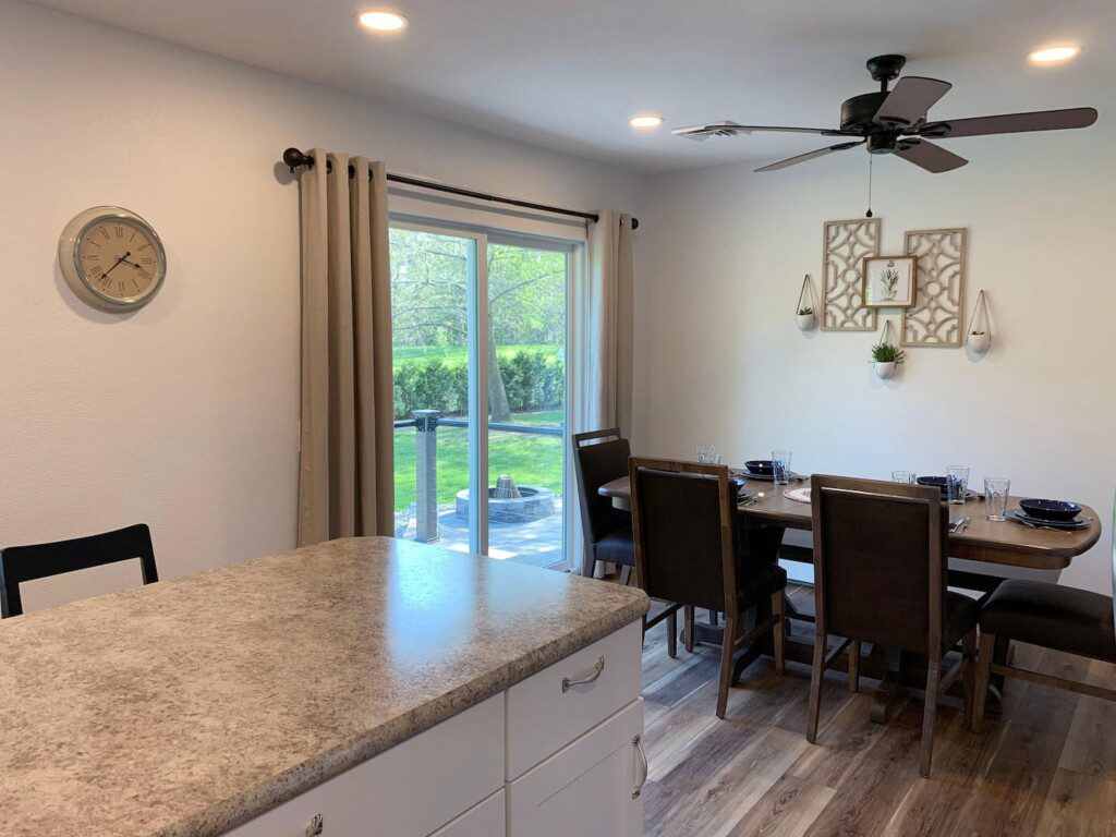 View of dining room and outdoor patio access from kitchen.