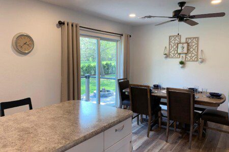 View of dining room and outdoor patio access from kitchen.
