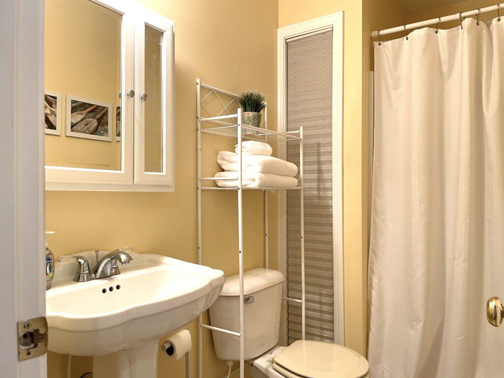 Bathroom #2: Cabin shower stocked with towels, soap, and shampoo