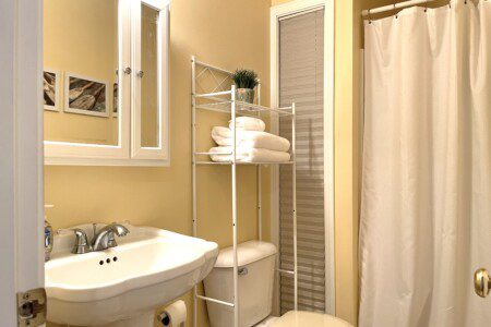 Bathroom #2: Cabin shower stocked with towels, soap, and shampoo