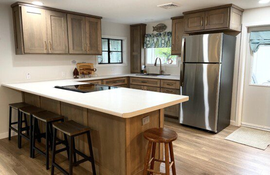 Stone Lake Cottage Retreat: Everything you need without the clutter — plus a peninsula bar for extra seating and easy conversation.