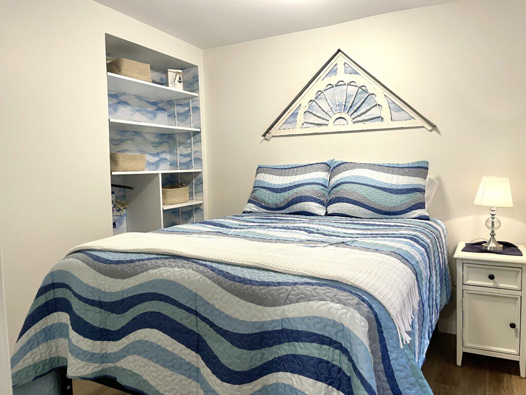 Stone Lake Cottage Retreat: Full bed + charging nightstand = restful and ready for tomorrow.