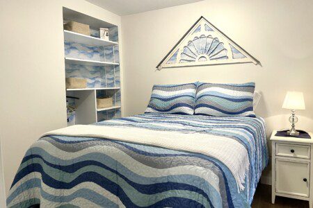 Stone Lake Cottage Retreat: Full bed + charging nightstand = restful and ready for tomorrow.