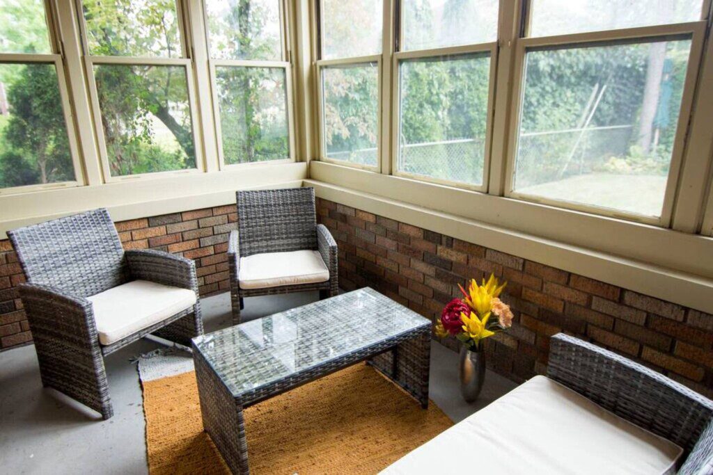 Relish outdoors from the comfort of indoors!! This three-season sitting room off of the living room is a great place to enjoy some peace and quiet!