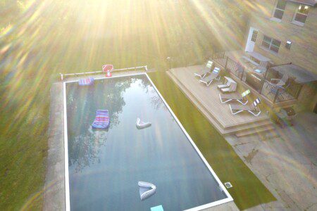 Family Fun at Riverside Pool Paradise! Splash in the pool, relax in the hot tub, or enjoy yard games. Spacious deck with seating! Toddler cabana, & custom art.