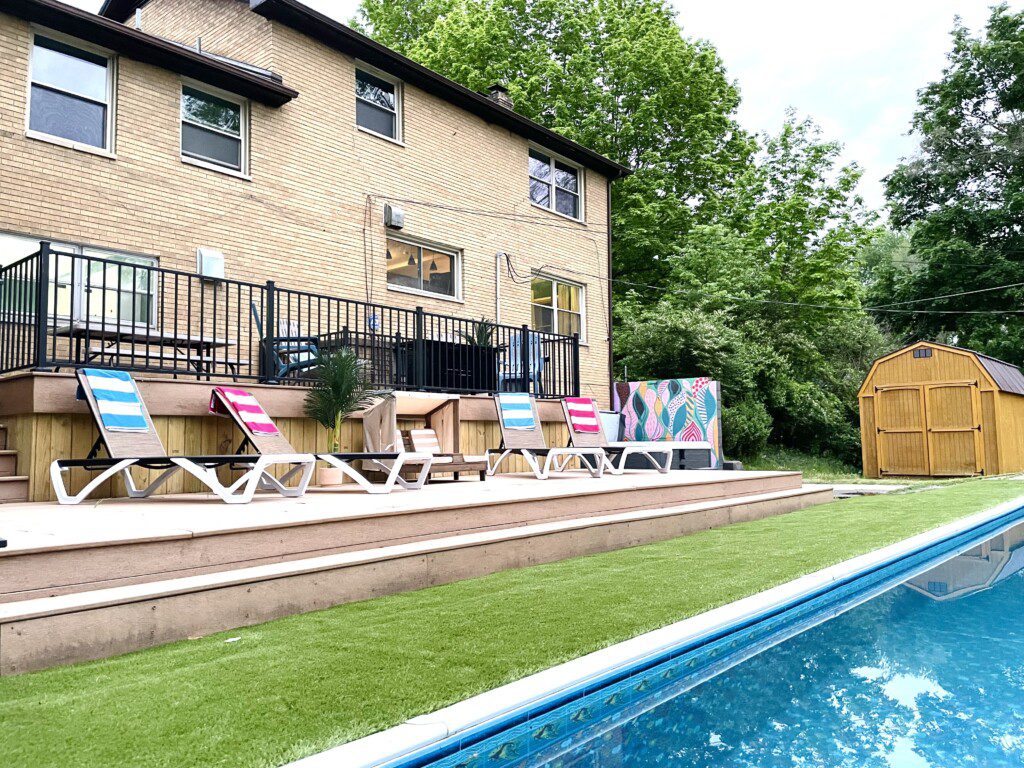 Family Fun at Riverside Pool Paradise! Splash in the pool, relax in the hot tub, or enjoy yard games. Spacious deck with seating! Toddler cabana, & custom art.