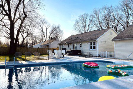 Enjoy the ultimate relaxation with poolside vibes, a soothing hot tub, and a cozy fire pit. Whether you're playing backyard games, grilling your favorite meal, or just lounging under the twinkling lights, this space is your perfect escape for a wonde
