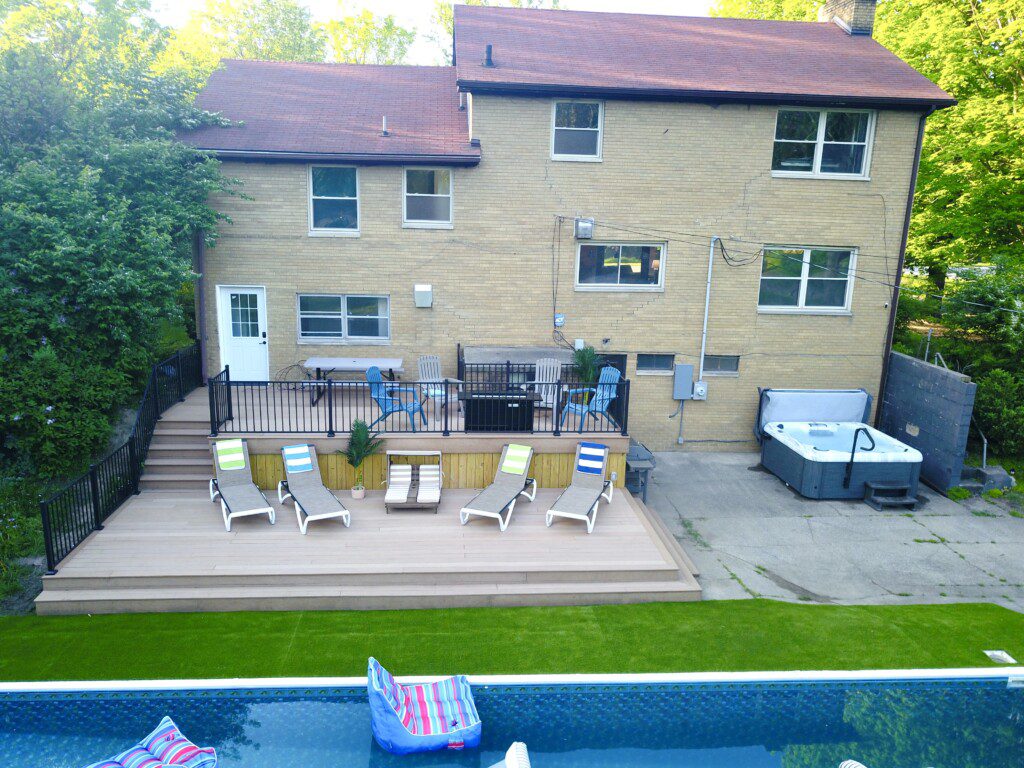 Family Fun at Riverside Pool Paradise! Splash in the pool, relax in the hot tub, or enjoy yard games. Spacious deck with seating! Toddler cabana, & custom art.