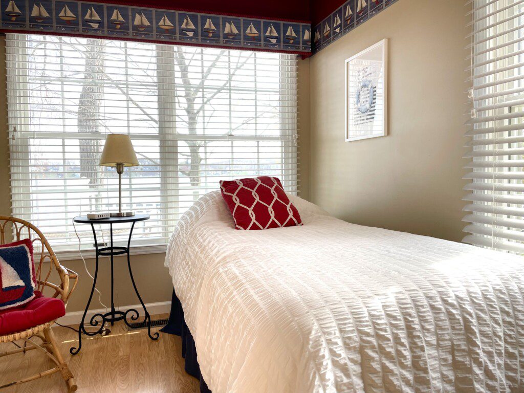 Bedroom #2: A cozy retreat with a double bed, twin bed, and a nightstand with a charging station for your convenience.