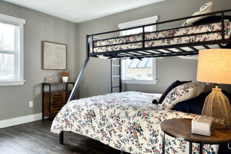 Bedroom #2 - queen bed with a twin bunk on top, charging alarm clocks