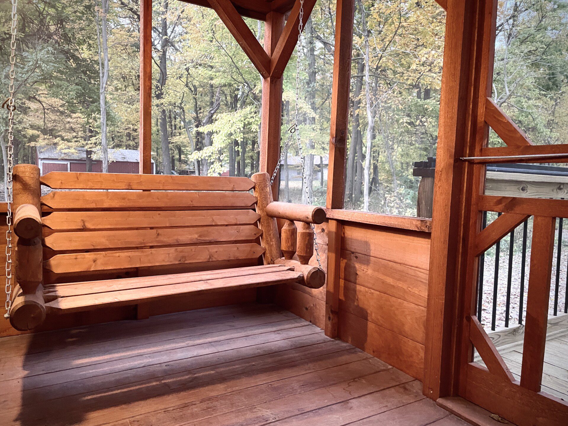 ✨ Imagine yourself here, relaxing on the porch swing in a screened-in oasis. Sway in comfort, surrounded by serene forest views—your peaceful retreat awaits!