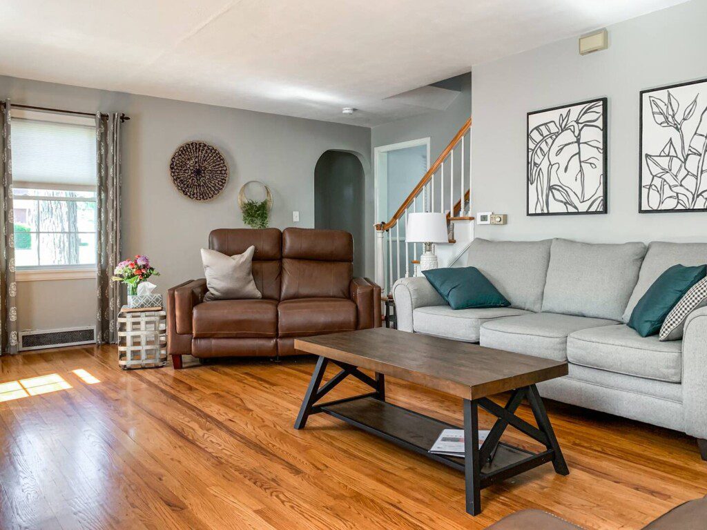 Living Room with 55" Roku TV with YouTube TV access. Very high quality power reclining love seats!!