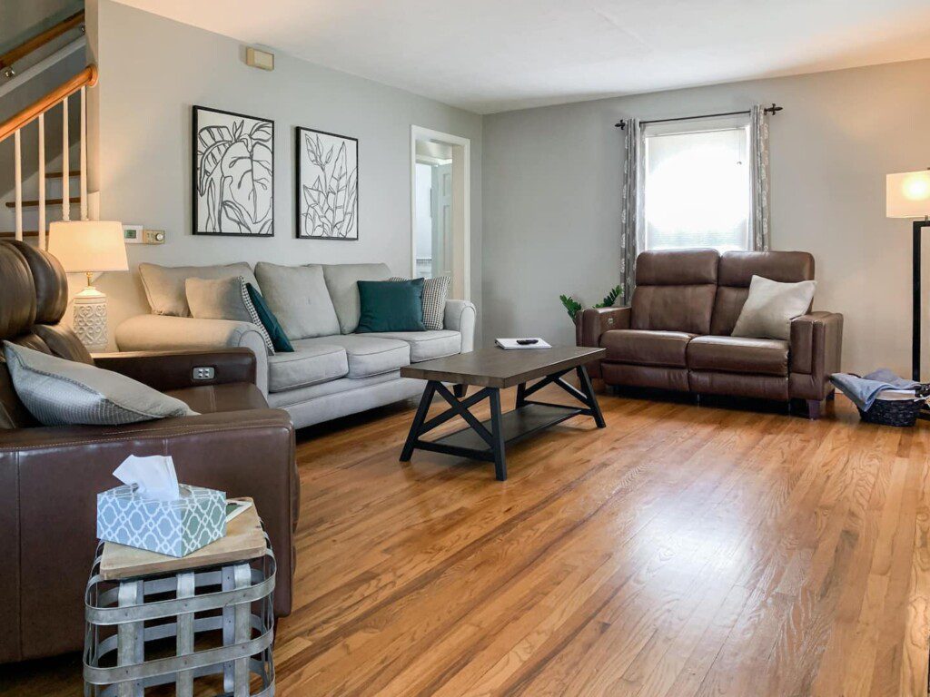Living Room with 55" Roku TV with YouTube TV access. Very high-quality power reclining love seats!!