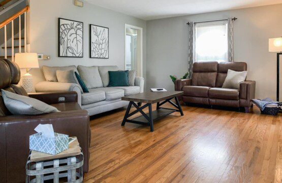 Living Room with 55" Roku TV with YouTube TV access. Very high-quality power reclining love seats!!