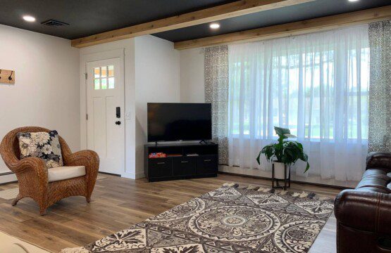 Living Room with 55" Roku TV with YouTube TV access (cable-like access).