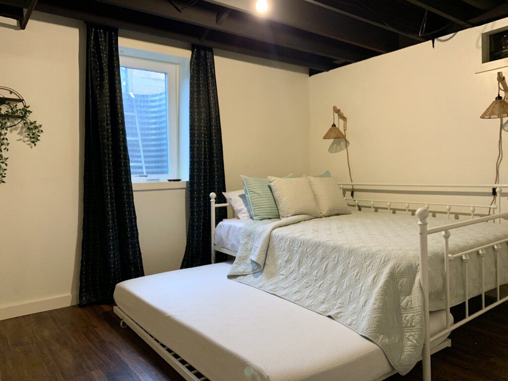 Bedroom #4 in basement with highly rated Lucid queen mattress AND a pull out Lucid double bed (full bed) with 43" Roku Smart TV