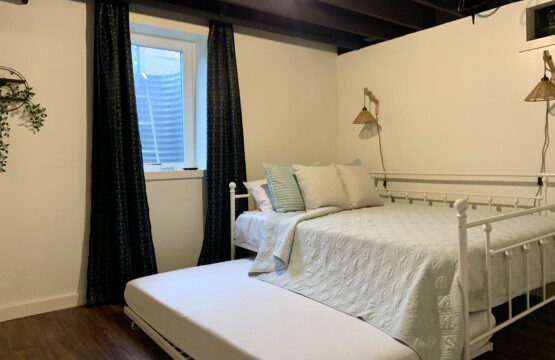 Bedroom #4 in basement with highly rated Lucid queen mattress AND a pull out Lucid double bed (full bed) with 43" Roku Smart TV