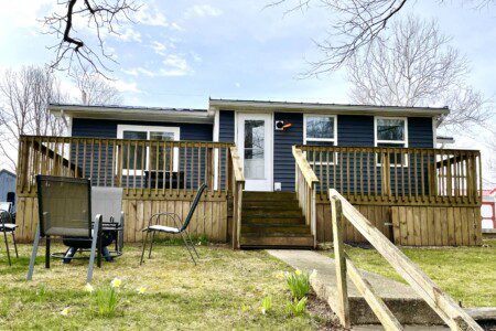 The Pigeon River Retreat: the view of the house from down by the river