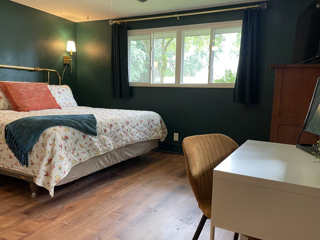 Bedroom #1 with highly rated Lucid KING mattress; a clock w/ USB and outlets to make charging devices super convenient; Reading Lights; 43" Roku Smart TV