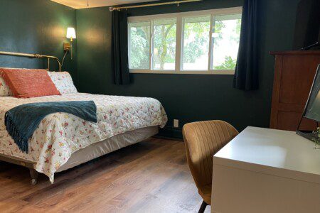 Bedroom #1 with highly rated Lucid KING mattress; a clock w/ USB and outlets to make charging devices super convenient; Reading Lights; 43" Roku Smart TV