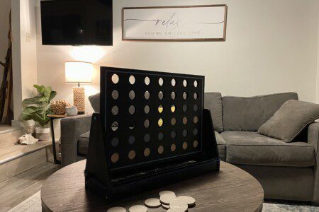 Waldron Lake Retreat: Experience ultimate relaxation in our open-concept living and sitting rooms, featuring stunning lake views. Enjoy your favorite shows on the Roku TV with YouTube TV.