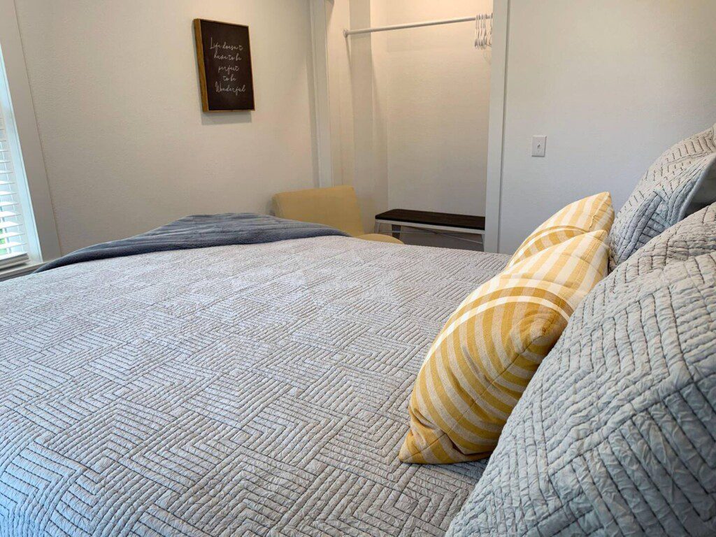 Bedroom #2 - comfortable queen bed; USB clock right beside the bed for all your charging needs