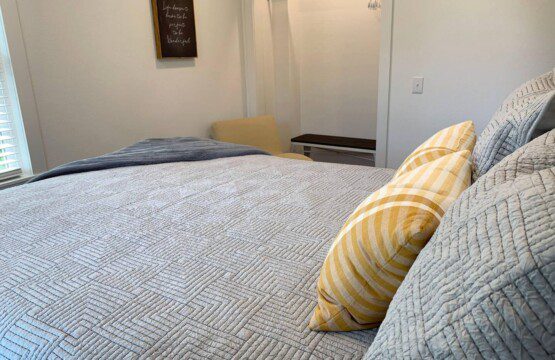 Bedroom #2 - comfortable queen bed; USB clock right beside the bed for all your charging needs