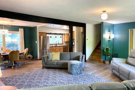 Open Concept for Gatherings! The open-concept living room at Riverside Paradise is perfect for connecting. Kids can play, families can dine, and everyone can enjoy movies on the 65" Fire TV. Custom wall art adds a unique touch to this spacious haven