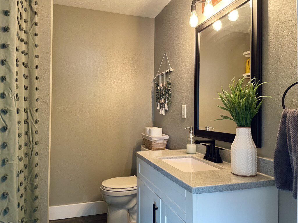 Bathroom with shower/tub combination - furnished with towels, washcloths, soap/shampoo/hairdryer, and more