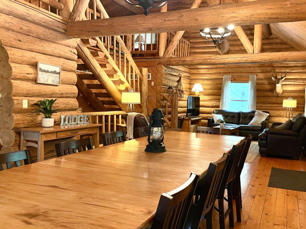 Trillium Lane Cabin Dining Room - enjoy the quiet ambiance of the open concept log cabin in the comfortable living room, or enjoy a movie on the 50" Roku Smart TV