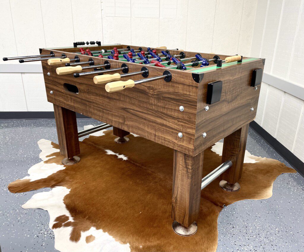 The Waldron Lake Retreat Bonus Game Room: Unwind and have a blast! From foosball and poker nights to cozy movie marathons on the 55" Roku TV with YouTubeTV, we've got all the fun vibes covered—complete with awesome lighting and board games!