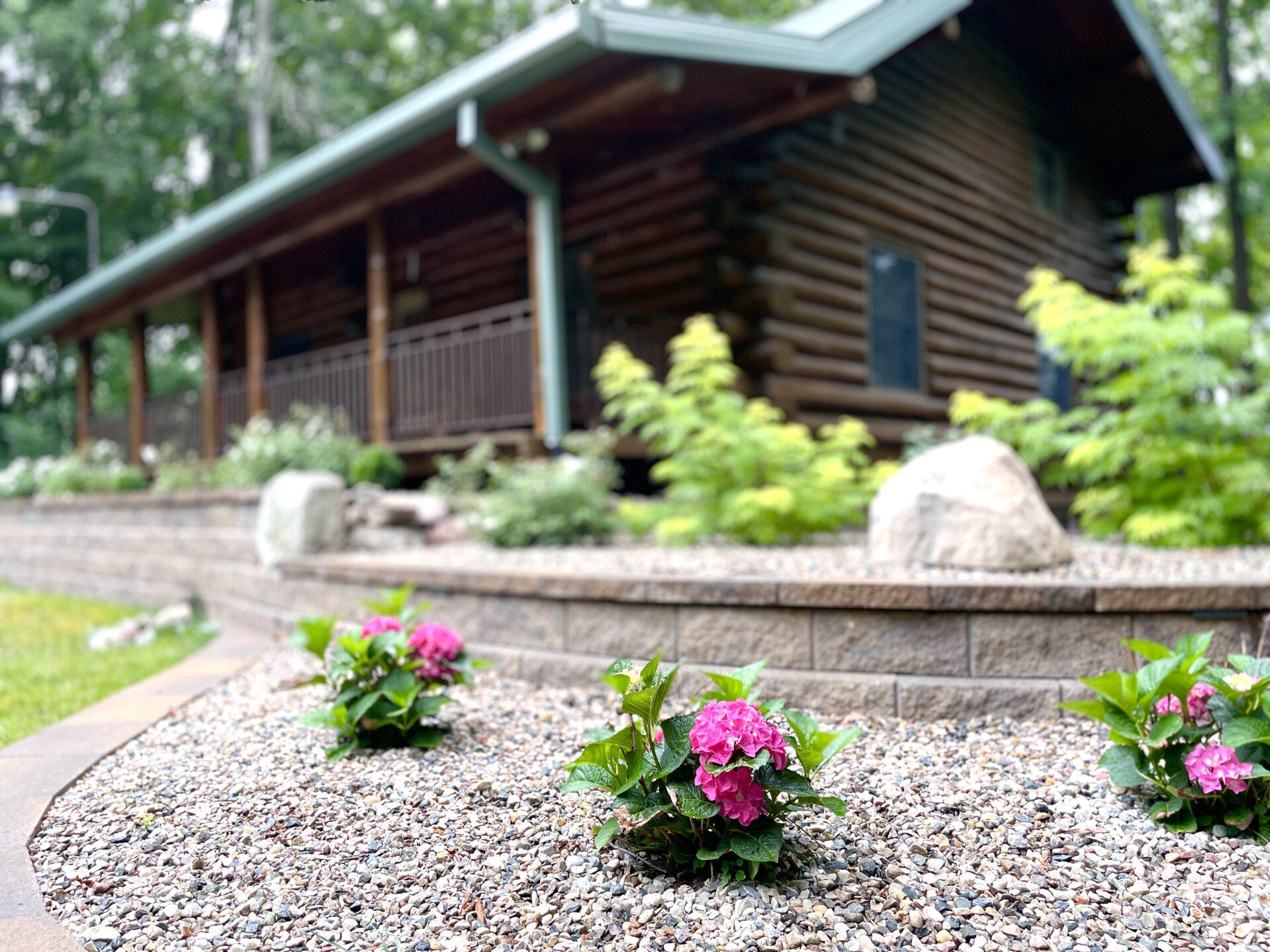 Trillium Lane Cabin - sit back and relax to enjoy nature all around you on the front porch in complete seclusion. Hot tub out walkout basement; outdoor fireplace (not pictured)