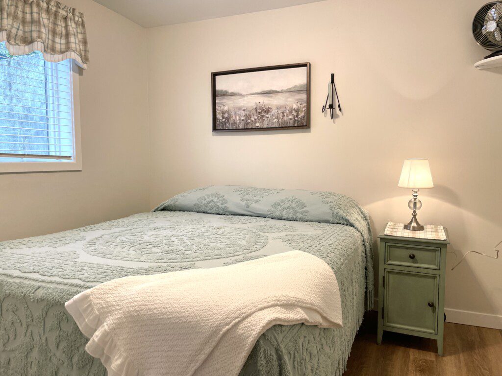 Stone Lake Cottage Retreat: Queen bed + charging nightstand = restful and ready for tomorrow.