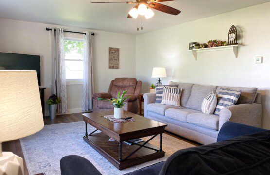 Living Room with 55" Samsung SmartTV with complimentary YouTubeTV access (sleeper sofa can sleep two people).