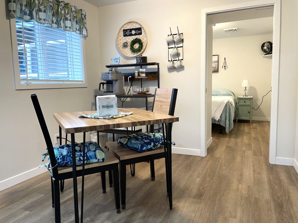 Stone Lake Cottage Retreat: Small but mighty — a dining table for meals or games, plus a stocked coffee bar just steps away.