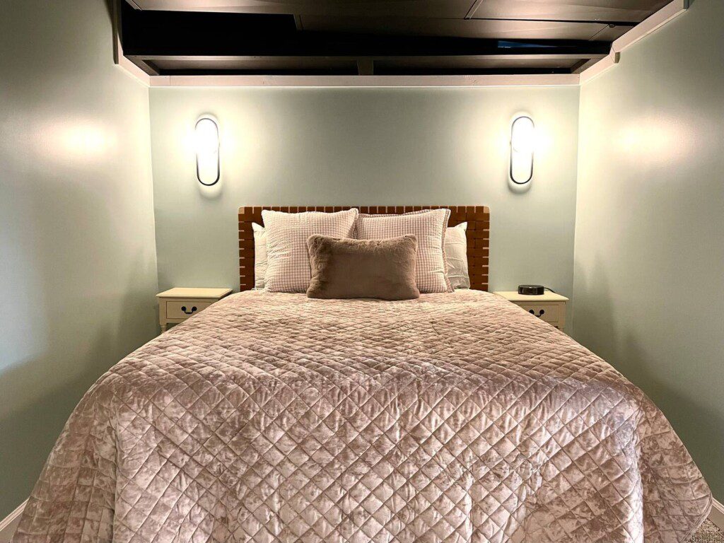 Basement Bedroom with two queen beds; nightstand a clocks w/ USB and outlets to make charging devices super convenient